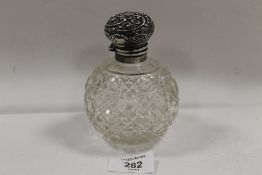 A SILVER MOUNTED SCENT BOTTLE - (STOPPER STUCK)