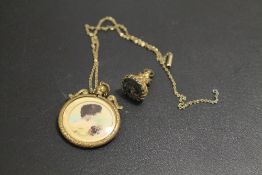 AN ANTIQUE LOCKET AND CHAIN AND ANTIQUE FOB SEAL