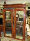 A LARGE VICTORIAN TWIN MIRRORED DOOR WARDROBE H-206 W-138 CM