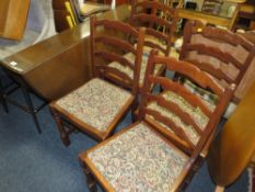 A SLIM OAK DROPLEAF TABLE AND FOUR CHAIRS