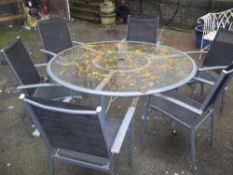 A MODERN GARDEN TABLE WITH 6 CHAIRS