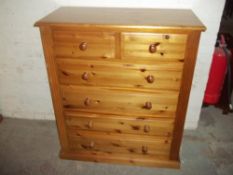 A SOLID PINE CHEST OF DRAWERS