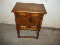 AN OAK 2 DOOR CABINET