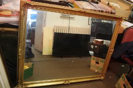 A LARGE GILT MIRROR 138 CM X 104 CM