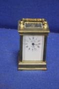 A BRASS FRENCH MAID CARRIAGE CLOCK