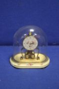 A KERN GLASS DOMED MANTLE CLOCK