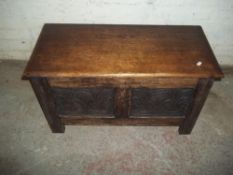 AN ANTIQUE OAK COFFER