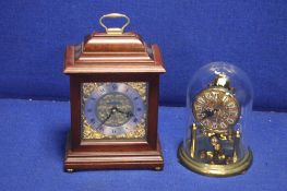A KUNDO DOME CLOCK TOGETHER WITH A MANTLE CLOCK