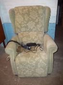 A WING BACK RISE AND RECLINE ARMCHAIR