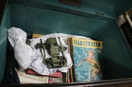 A TIN TRUNK CONTAINING DINKY MILITARY VEHICLES, MAGAZINES ETC