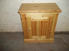 A SOLID PINE 2 DOOR CUPBOARD