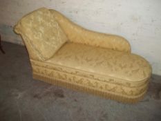 A GOLD FABRIC CHAISE LOUNGE