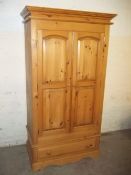 A SOLID PINE 2 DOOR WARDROBE