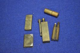 FIVE TRENCH ART TYPE BRASS LIGHTER, INCLUDING AN UNUSUAL ROOK TYPE
