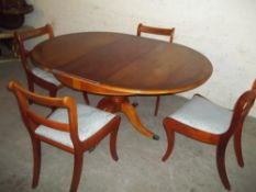 A REPRODUCTION DINING TABLE AND 4 CHAIRS