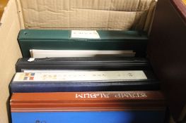 A QUANTITY OF ASSORTED STAMPS IN ALBUMS