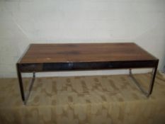 A CHROME AND ROSEWOOD COFFEE TABLE