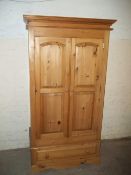 A SOLID PINE 2 DOOR WARDROBE