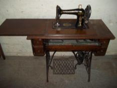 an antique singer sewing machine and table