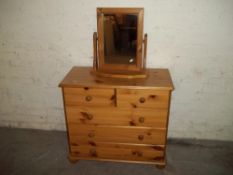 A PINE 5 DRAWER CHEST AND A SWIVEL MIRROR