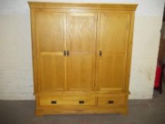 AN OAK 3 DOOR TRIPLE WARDROBE