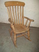 A BEECH STYLE ROCKING CHAIR