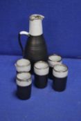 A STONEWARE POT AND 5 MUGS