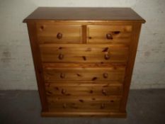 A SOLID PINE CHEAST OF DRAWERS
