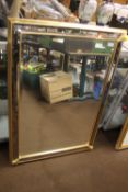 A FRAMED MIRROR 102 CM X 73
