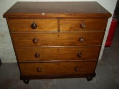 AN ANTIQUE CHEST OF DRAWERS