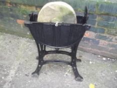 A VINTAGE SHARPENING STONE AND STAND