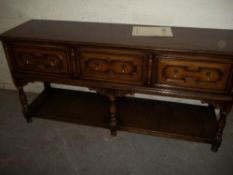A SOLID OAK SIDEBOARD