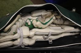 A QUANTITY OF CRICKET PADS, GLOVES ETC