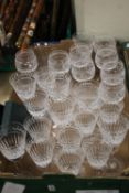 A TRAY OF CUT GLASS DRINKING GLASSES (TRAY NOT INCLUDED)