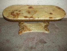 A BRASS AND ONYX TABLE