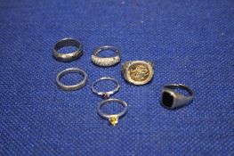 SEVEN SILVER AND WHILE METAL RINGS (7)