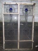 A STEEL WINDOW FRAME WITH LEADED GLASS