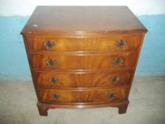A MAHOGANY BOW FRONTED CHEST OF DRAWERS