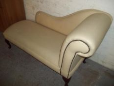 A FAUX LEATHER CHAISE LOUNGE