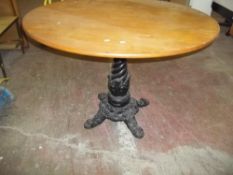 A CAST IRON DINING TABLE