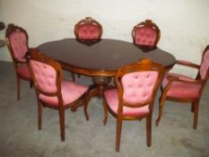 AN ITALIAN ROCCOCCO STYLE DINING TABLE AND CHAIRS