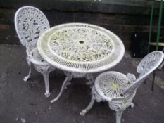 A CAST GARDEN TABLE SET WITH TWO CHAIRS