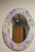 A DECROATIVE OVAL MIRROR