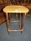 AN INDUSTRIAL STYLE STOOL WITH COPPER EFFECT LEGS