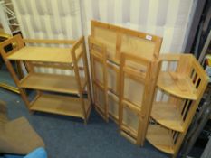 A PAIR OF FOLDING SHELVES WITH A CORNER SHELF