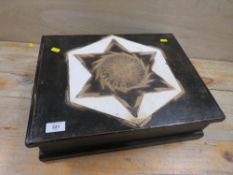 A VINTAGE DESKTOP BOX WITH DECORATION TO THE TOP