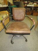 A MODERN BROWN LEATHER SWIVEL OFFICE CHAIR