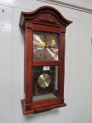 A MODERN LINCOLN 31 DAY WALL CLOCK