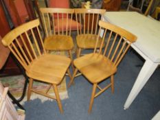 A SET OF FOUR MODERN OAK STICKBACK DINING CHAIRS