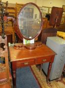 A VICTORIAN MAHOGANY DRESSING TABLE WITH OVAL MIRROR